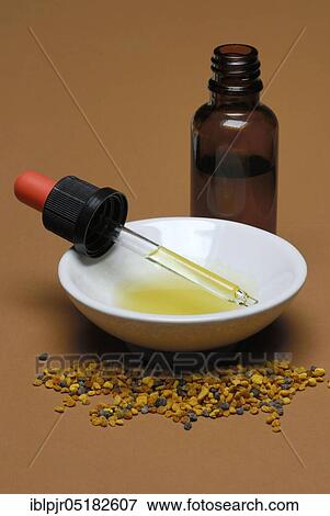 Propolis tincture, and flower pollen, bee putty resin, bee resin, putty resin, propolis, putty wax View Large Photo Image Stock Photo - Propolis tincture, and flower pollen, bee putty resin, bee resin, putty resin, propolis, putty wax. Fotosearch