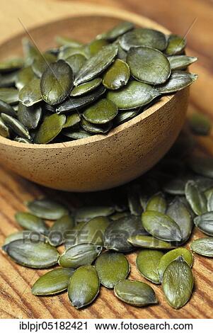 Pumpkin seed in wooden spoon (Cucurbita spec. ) View Large Photo Image Stock Image - Pumpkin seed in wooden spoon (Cucurbita spec. ). Fotosearch