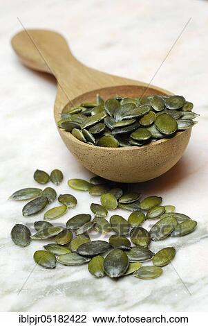 Pumpkin seed in wooden spoon (Cucurbita spec. ) View Large Photo Image Stock Image - Pumpkin seed in wooden spoon (Cucurbita spec. ). Fotosearch