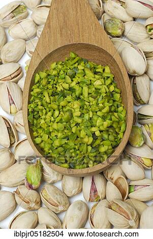 Real Pistachios (Pistacia vera), chopped seeds in wooden spoon View Large Photo Image Picture - Real Pistachios (Pistacia vera), chopped seeds in wooden spoon. Fotosearch