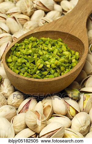 Real Pistachios (Pistacia vera), chopped seeds in wooden spoon View Large Photo Image Stock Photography - Real Pistachios (Pistacia vera), chopped seeds in wooden spoon. Fotosearch