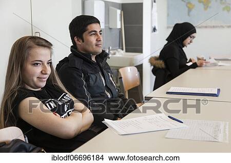 Picture - Refugee class in the Training Preparation International (AVI) of the Elly-Heuss-Knapp-Schule, a vocational college of the city of Düsseldorf, North Rhine-Westphalia, Germany, Europe. Fotosearch