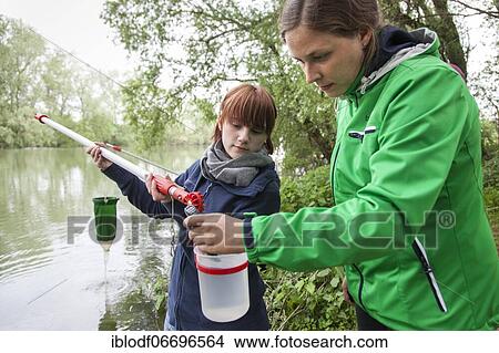 Researchers from Prof. Dr. Jens Boenigk's group at the University of Duisburg-Essen checking water samples near Grietherbusch on the Lower Rhine, North Rhine-Westphalia, Germany, Europe View Large Photo Image Picture - Researchers from Prof. Dr. Jens Boenigk's group at the University of Duisburg-Essen checking water samples near Grietherbusch on the Lower Rhine, North Rhine-Westphalia, Germany, Europe. Fotosearch