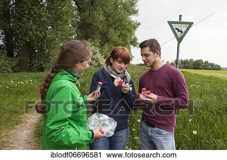 Researchers of the Biodiversity Group of the University of Duisburg-Essen labelling water samples at Grietherbusch in the Lower Rhine region, North Rhine-Westphalia, Germany, Europe View Large Photo Image Stock Image - Researchers of the Biodiversity Group of the University of Duisburg-Essen labelling water samples at Grietherbusch in the Lower Rhine region, North Rhine-Westphalia, Germany, Europe. Fotosearch