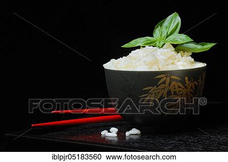 Rice bowl with chopsticks, rice grain, rice grains View Large Photo Image Stock Image - Rice bowl with chopsticks, rice grain, rice grains. Fotosearch