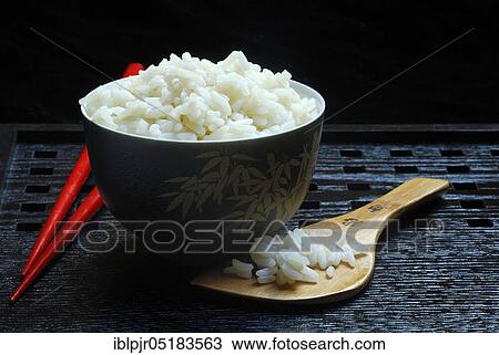 Rice bowl with chopsticks, rice grain, rice grains View Large Photo Image Stock Image - Rice bowl with chopsticks, rice grain, rice grains. Fotosearch