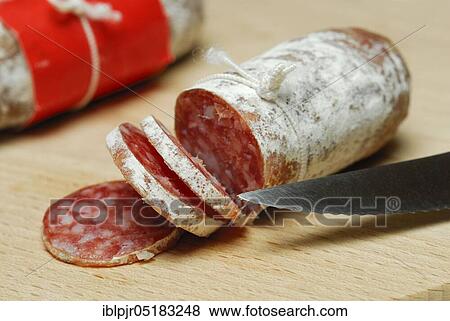 Salametti with knife on wooden board, sausages, salami View Large Photo Image Stock Photo - Salametti with knife on wooden board, sausages, salami. Fotosearch