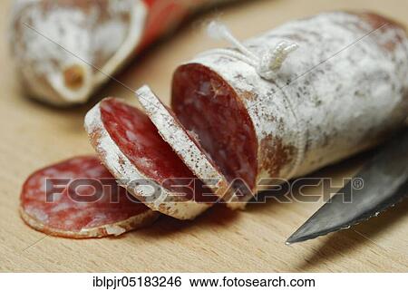 Salametti with knife on wooden board, sausages, salami View Large Photo Image Stock Photograph - Salametti with knife on wooden board, sausages, salami. Fotosearch