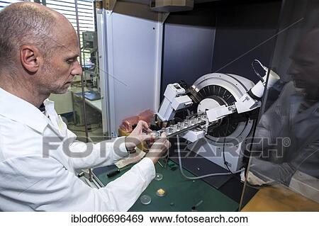 Stock Photo - Scientific assistant at the X-ray apparatus during his research work, Faculty of Biology, Department of Geology, X-ray laboratory at the University of Duisburg-Essen, Essen, North Rhine-Westphalia, Germany, Europe. Fotosearch