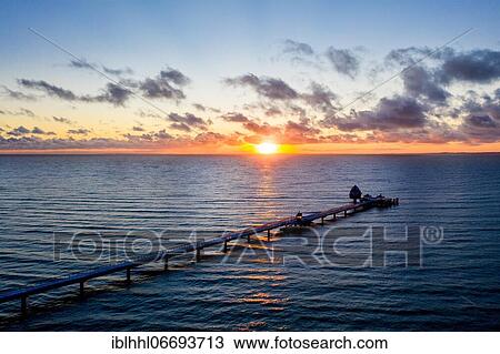 Stock Image - Sea bridge of Grömitz in the sunrise, Baltic Sea coast, Grömitz, Schleswig Holstein, Germany, Europe. Fotosearch