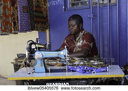 Stock Photograph - Seamstress, sewing, sewing machine, solvezi, zambia. Fotosearch