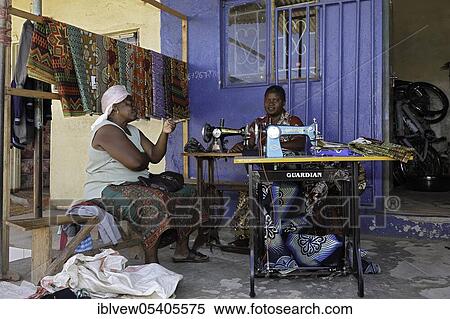 Stock Photography - Seamstress, sewing, sewing machine, solvezi, zambia. Fotosearch