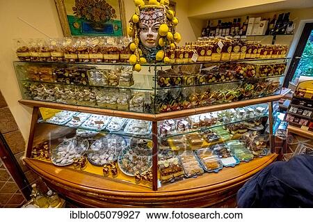Shop with cake and confectionery display, ceramic head with lemon decoration, Taormina, Southern Italy, Sicily, Italy, Europe View Large Photo Image Stock Photo - Shop with cake and confectionery display, ceramic head with lemon decoration, Taormina, Southern Italy, Sicily, Italy, Europe. Fotosearch