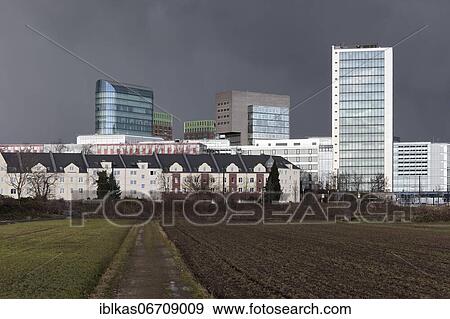 Skyline Düsseldorfer Medienhafen, skyscrapers The Sign, Win Win, dock, Media Tower, in front farmland, thunderstorm sky, Düsseldorf, North Rhine-Westphalia, Germany, Europe View Large Photo Image Stock Photo - Skyline Düsseldorfer Medienhafen, skyscrapers The Sign, Win Win, dock, Media Tower, in front farmland, thunderstorm sky, Düsseldorf, North Rhine-Westphalia, Germany, Europe. Fotosearch