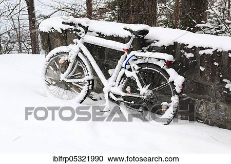 Stock Image - Snowy bike, bicycle, Switzerland, Europe. Fotosearch
