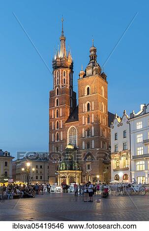 St. Mary's Basilica (Kosciol Mariacki) on the Main Market Square (Rynek Glowny) in Krakow, Poland, Europe View Large Photo Image Stock Photograph - St. Mary's Basilica (Kosciol Mariacki) on the Main Market Square (Rynek Glowny) in Krakow, Poland, Europe. Fotosearch