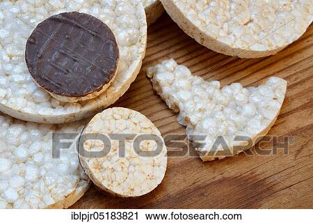 Stock Image - Stacked rice wafers, chocolate coated rice wafers, rice cake. Fotosearch