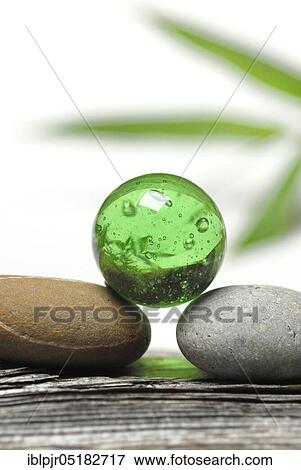 Stock Photo - Stacked stones, marble, glass ball. Fotosearch