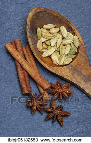 Stock Image - Star anise, cinnamon stick, cardamom ( Illicium verum) ( Cinnamomum spec. ), ( Elettaria cardamomum). Fotosearch