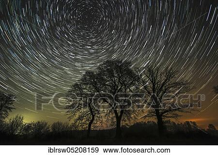 Stock Photo - Star trails, Lower Saxony, Germany, Europe. Fotosearch