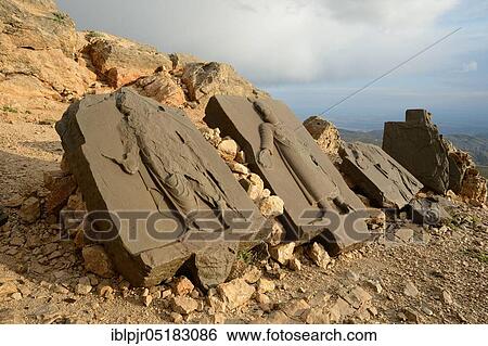 Stock Photograph - Stone reliefs at Nemrut Dagi, Anatolia, Adiyaman Province, memorial, Nemrud, stone relief, stone slabs with representations at the burial mound of King Antiochus, burial shrine, western terrace, Turkey, Asia. Fotosearch