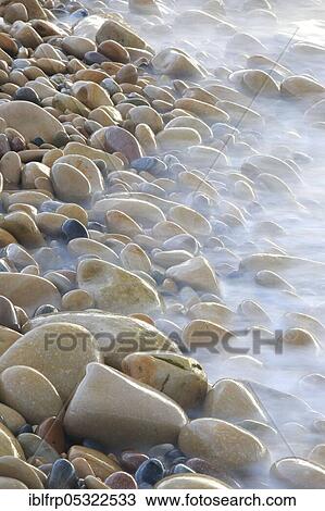 Stock Image - Stones on the beach, England, United Kingdom, Europe. Fotosearch