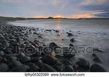 Stony beach in Northumberland, Great Britain View Large Photo Image Stock Photo - Stony beach in Northumberland, Great Britain. Fotosearch