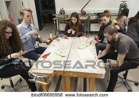 Students in the design class make a work of art with wire, at the Elly-Heuss-Knapp-Schule, a vocational college of the city of Düsseldorf, North Rhine-Westphalia, Germany, Europe View Large Photo Image Stock Photo - Students in the design class make a work of art with wire, at the Elly-Heuss-Knapp-Schule, a vocational college of the city of Düsseldorf, North Rhine-Westphalia, Germany, Europe. Fotosearch