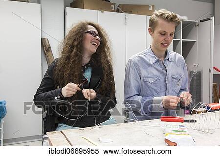 Students in the design class make a work of art with wire, at the Elly-Heuss-Knapp-Schule, a vocational college of the city of Düsseldorf, North Rhine-Westphalia, Germany, Europe View Large Photo Image Stock Photography - Students in the design class make a work of art with wire, at the Elly-Heuss-Knapp-Schule, a vocational college of the city of Düsseldorf, North Rhine-Westphalia, Germany, Europe. Fotosearch