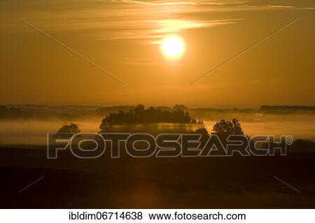 Sunrise with morning fog, Masuria, Poland, Europe View Large Photo Image Stock Photo - Sunrise with morning fog, Masuria, Poland, Europe. Fotosearch