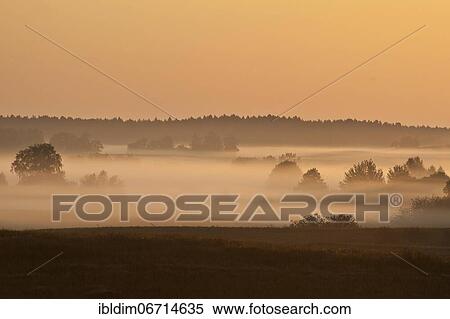 Sunrise with morning fog, Masuria, Poland, Europe View Large Photo Image Stock Photography - Sunrise with morning fog, Masuria, Poland, Europe. Fotosearch
