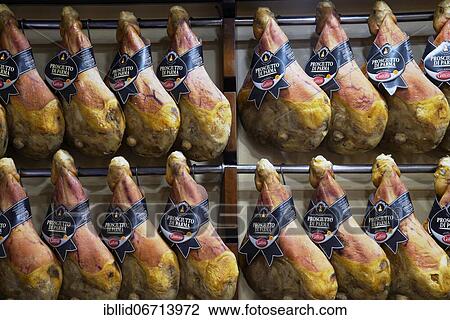 Suspended ham, Prosciutto di Parma, speciality shop, Bologna, Emilia Romagna, Italy, Europe View Large Photo Image Stock Image - Suspended ham, Prosciutto di Parma, speciality shop, Bologna, Emilia Romagna, Italy, Europe. Fotosearch