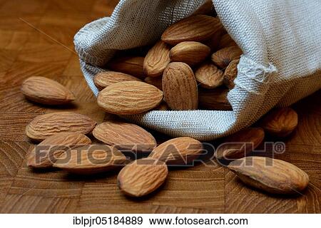 Stock Photo - Sweet almonds in linen bags ( Prunus dulcis). Fotosearch
