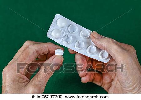 Stock Image - Tablets hand from senior. Fotosearch