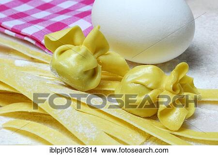 Picture - Tagliatelle and filled dough pearls, hen's egg, ribbon noodles, pearl al basilico, pasta, pasta, dough pearls, hen's eggs. Fotosearch