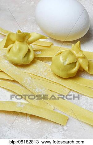Tagliatelle and filled dough pearls, hen's egg, ribbon noodles, pearl al basilico, pasta, pasta, dough pearls, hen's eggs View Large Photo Image Stock Image - Tagliatelle and filled dough pearls, hen's egg, ribbon noodles, pearl al basilico, pasta, pasta, dough pearls, hen's eggs. Fotosearch