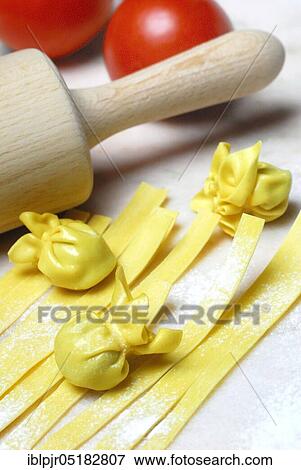 Tagliatelle and filled dough pearls, ribbon noodles, pearl al basilico, pasta, pasta, dough pearls View Large Photo Image Stock Photo - Tagliatelle and filled dough pearls, ribbon noodles, pearl al basilico, pasta, pasta, dough pearls. Fotosearch