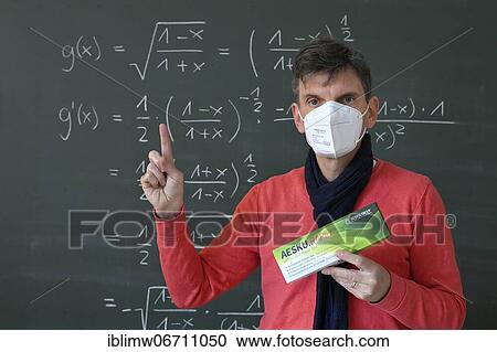 Teacher shows Corona antigen rapid test, in front of blackboard, face-to-face teaching, Corona crisis, Germany, Europe View Large Photo Image Stock Image - Teacher shows Corona antigen rapid test, in front of blackboard, face-to-face teaching, Corona crisis, Germany, Europe. Fotosearch