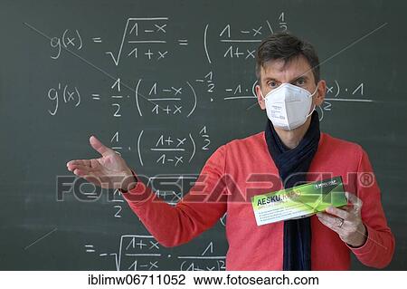 Teacher shows Corona antigen rapid test, in front of blackboard, face-to-face teaching, Corona crisis, Germany, Europe View Large Photo Image Stock Image - Teacher shows Corona antigen rapid test, in front of blackboard, face-to-face teaching, Corona crisis, Germany, Europe. Fotosearch