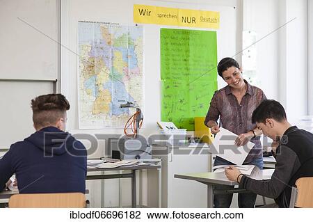 Teaching a refugee class or AVI, Ausbildungsvorbereitung International at the Elly-Heuss-Knapp-Schule, a vocational college of the city of Düsseldorf, North Rhine-Westphalia, Germany, Europe View Large Photo Image Stock Image - Teaching a refugee class or AVI, Ausbildungsvorbereitung International at the Elly-Heuss-Knapp-Schule, a vocational college of the city of Düsseldorf, North Rhine-Westphalia, Germany, Europe. Fotosearch