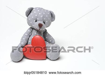 Stock Image - Teddy bear with red heart. Fotosearch