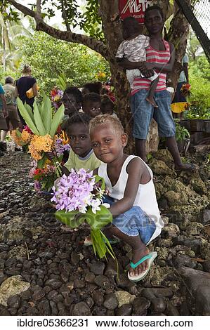 Telina Island locals greet visitors, Marovo Lagoon, Solomon Islands, Oceania View Large Photo Image Stock Image - Telina Island locals greet visitors, Marovo Lagoon, Solomon Islands, Oceania. Fotosearch