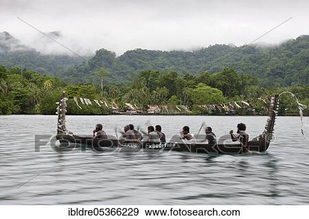 Stock Photo - Telina Island locals greet visitors, Marovo Lagoon, Solomon Islands, Oceania. Fotosearch