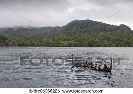 Stock Photography - Telina Island locals greet visitors, Marovo Lagoon, Solomon Islands, Oceania. Fotosearch