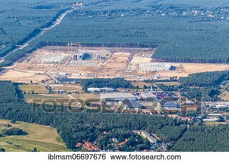 Stock Photograph - Tesla Gigafactory Berlin Brandenburg Grünheide factory construction site Giga Factory aerial view, Berlin, Germany, Europe. Fotosearch