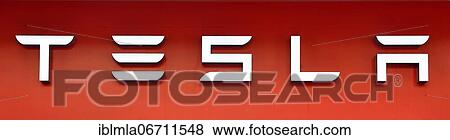 Stock Photo - Tesla lettering, corporate identity, cropped, red background. Fotosearch