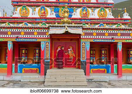 Tibetan Buddhism, Tibetan monk at new large painted and gilded stupa, stupa at Wutun Si monastery, Tongren, Repkong, Qinghai, formerly Amdo, Tibet, China, Asia View Large Photo Image Stock Photo - Tibetan Buddhism, Tibetan monk at new large painted and gilded stupa, stupa at Wutun Si monastery, Tongren, Repkong, Qinghai, formerly Amdo, Tibet, China, Asia. Fotosearch