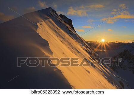 Stock Image - Titlis, Obwalden/Bern, Grisons Alps Alpenglow, Central Swiss Alps, Central Switzerland, Switzerland, Europe. Fotosearch