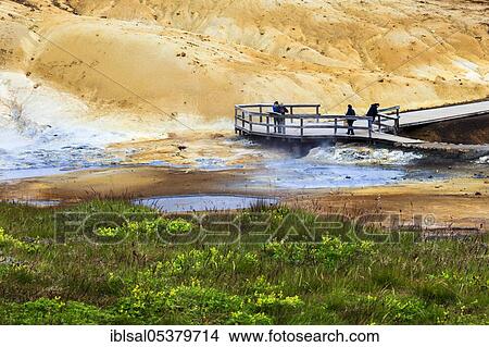 Picture - Tourists in the Seltun geothermal area, wooden jetty, mineral deposits, Krysuvik volcanic system, Iceland, Europe. Fotosearch