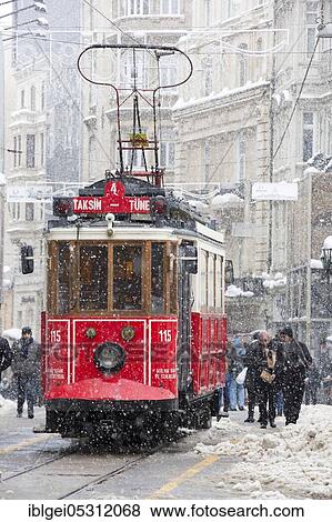 Stock Photo - Tram under sleet on Istiklal Street, Beyoglu, Turkey on January 10, 2017. Fotosearch